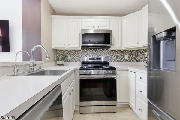 a kitchen with a stove and a microwave