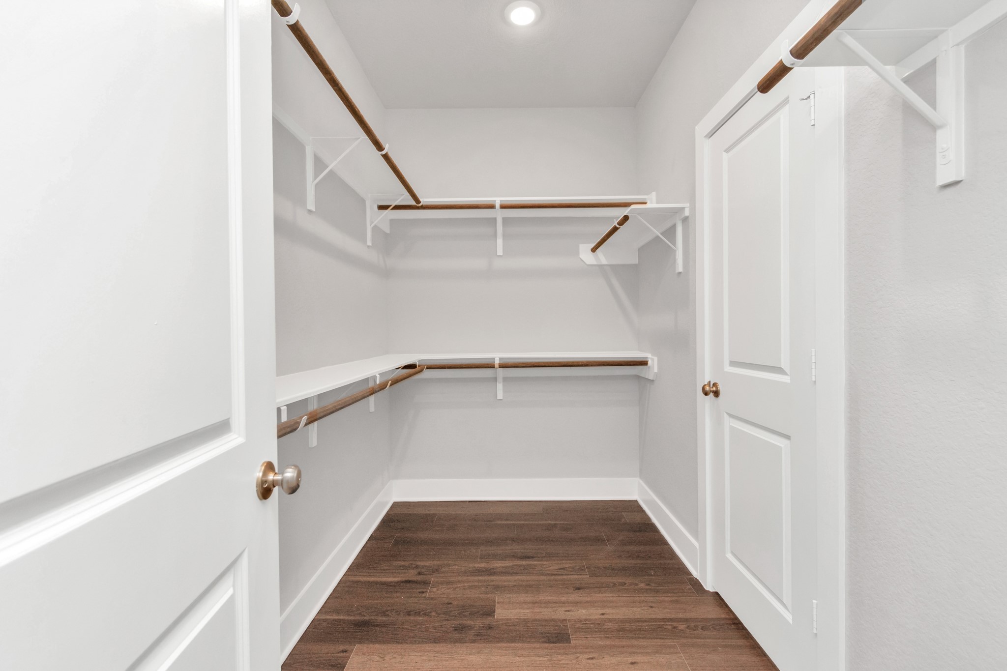 10502 Moon Valley Lane Rosharon, TX 77583 - Photo 11 of 23 a view of a hallway with wooden floor and entryway