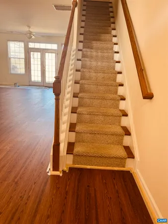 en view of an entryway with wooden floor