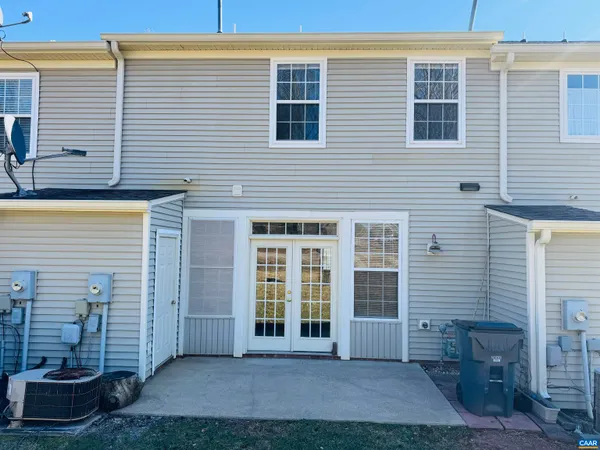a view of a brick house with many windows