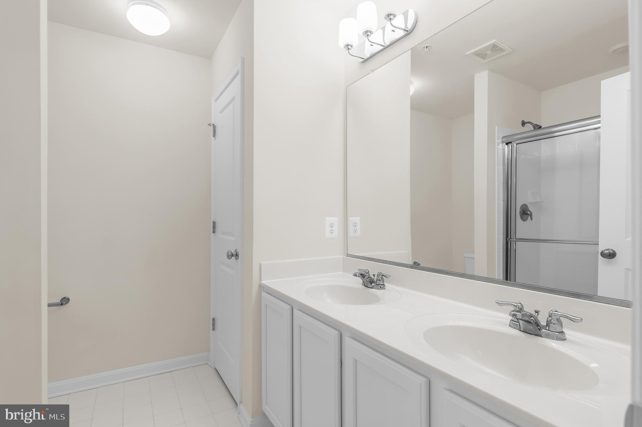 319 Appleby School Road Cambridge, MD 21613 - Photo 19 of 29 a bathroom with a sink and a mirror