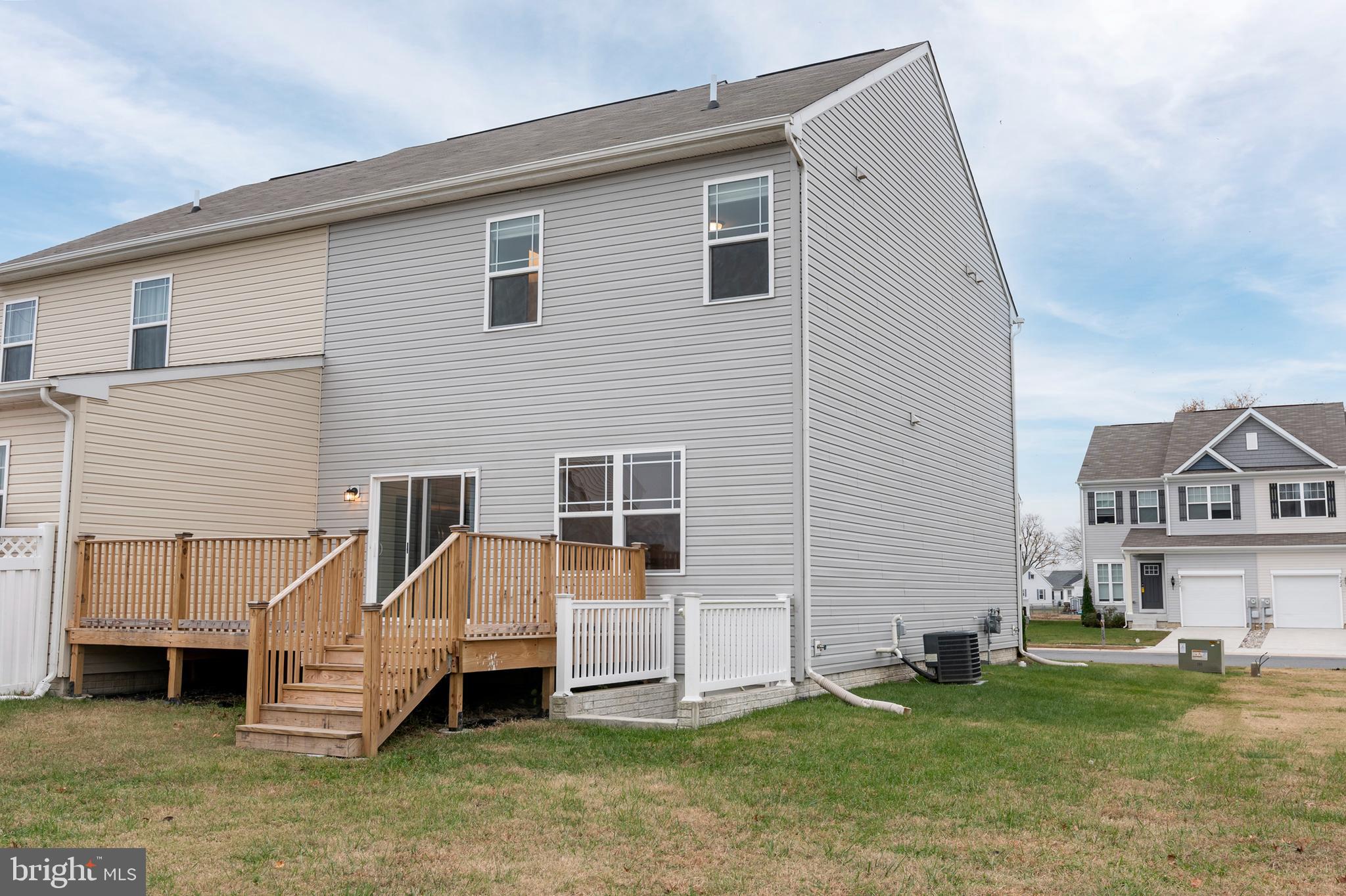 319 Appleby School Road Cambridge, MD 21613 - Photo 4 of 29 a front view of a house with a yard