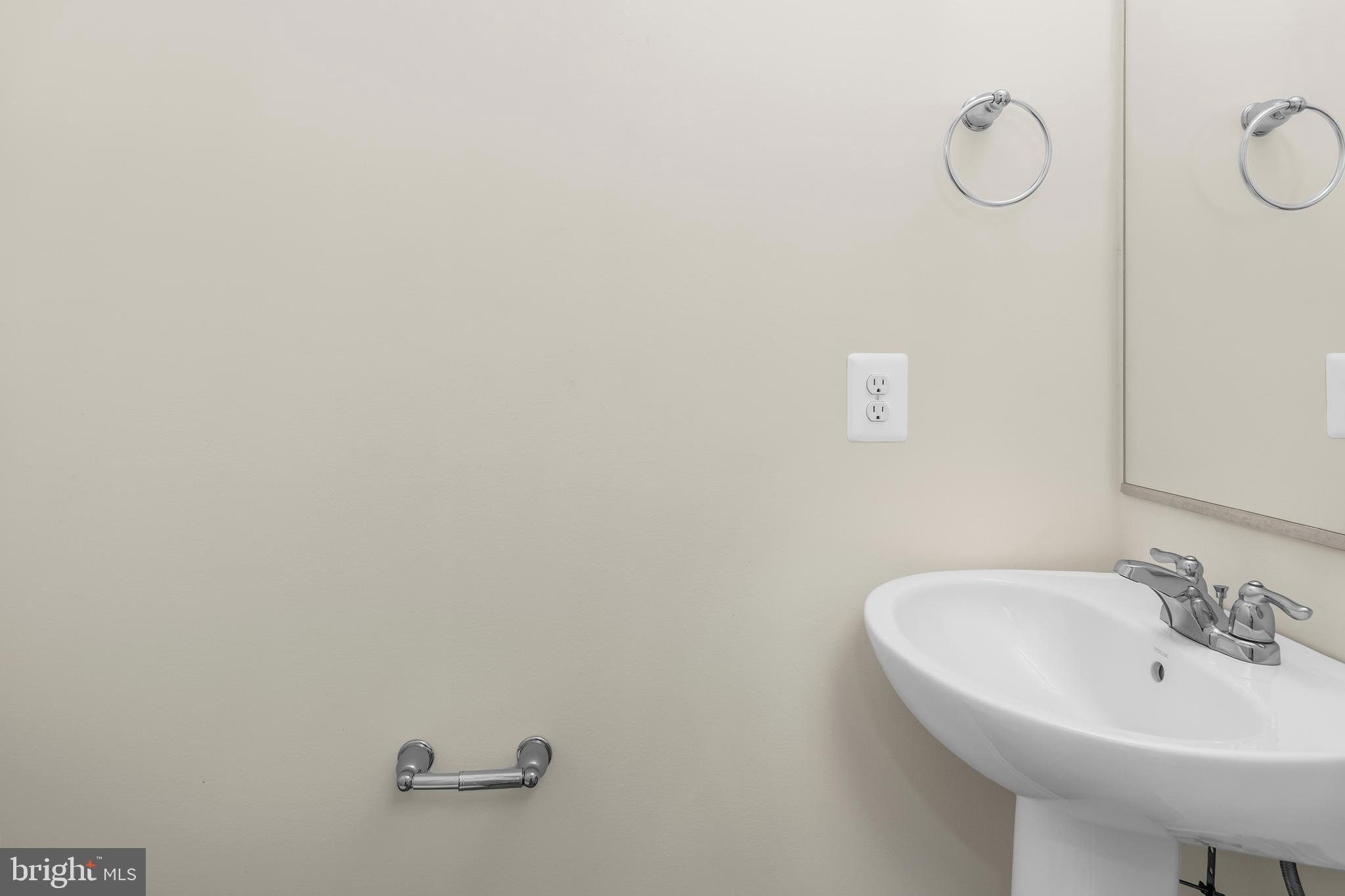319 Appleby School Road Cambridge, MD 21613 - Photo 9 of 29 a bathroom with a sink and mirror