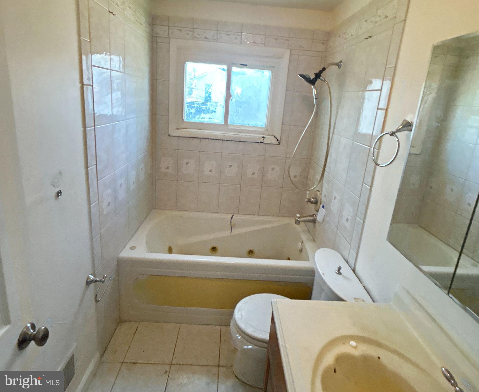 311 Ferndale Road Glen Burnie, MD 21061 - Photo 14 of 21 a bathroom with a sink a toilet and a bathtub