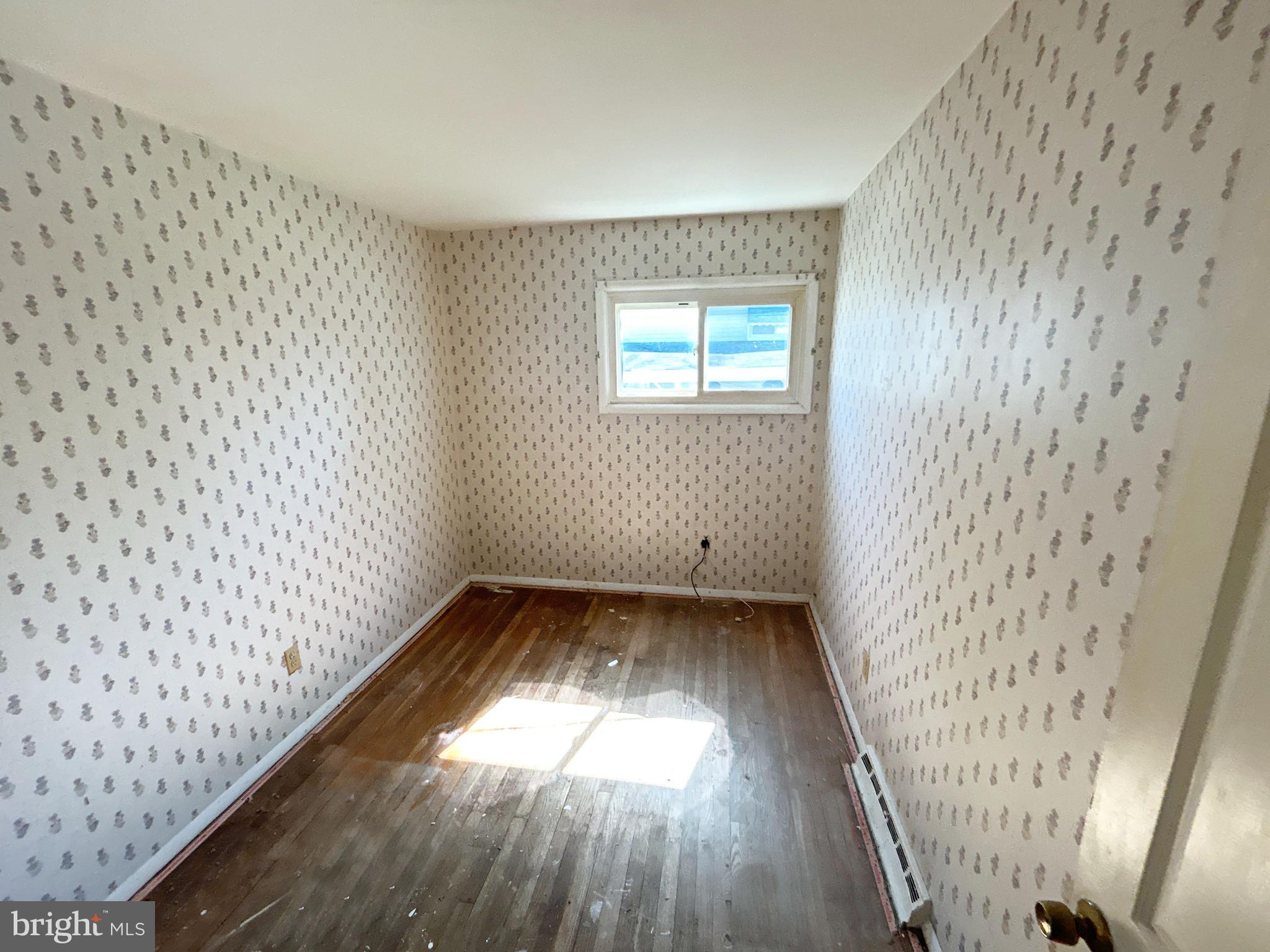 311 Ferndale Road Glen Burnie, MD 21061 - Photo 15 of 21 a view of a hallway with wooden floor and a window