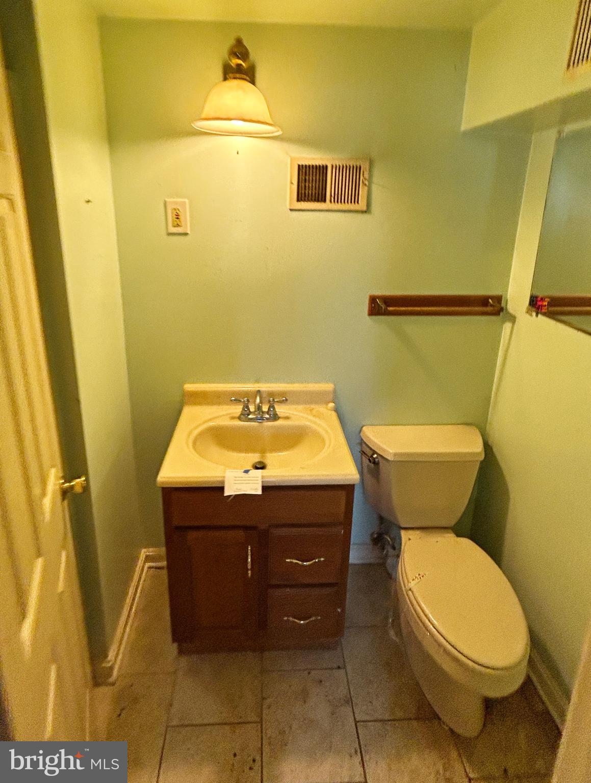 311 Ferndale Road Glen Burnie, MD 21061 - Photo 19 of 21 a bathroom with a sink and a toilet