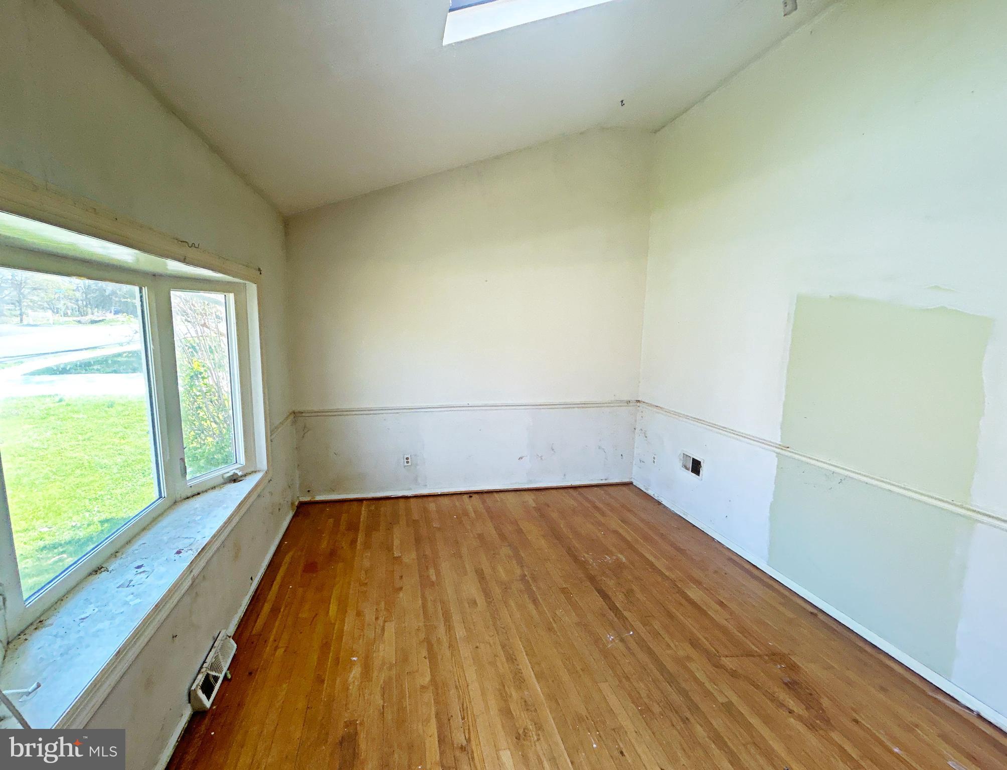311 Ferndale Road Glen Burnie, MD 21061 - Photo 6 of 21 a view of a room with wooden floor and small window