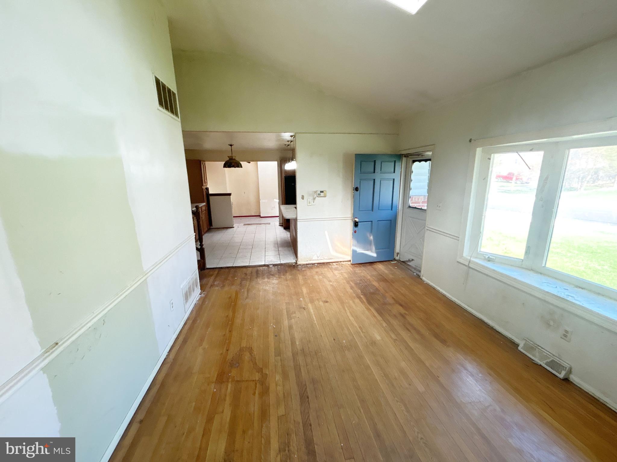 311 Ferndale Road Glen Burnie, MD 21061 - Photo 7 of 21 a view of a hallway with wooden floor and staircase