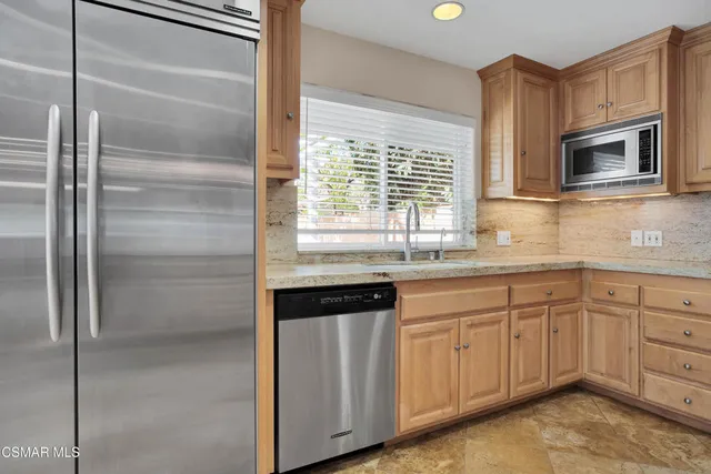 a kitchen with a sink and a microwave