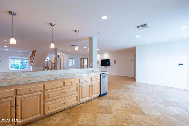 a large bathroom with a sink and a large mirror