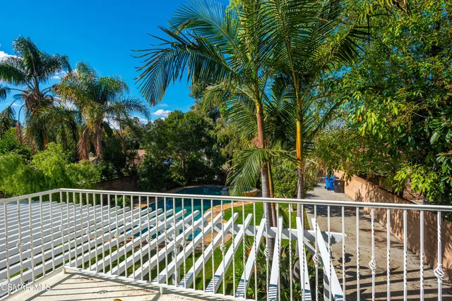 a view of outdoor space with deck and trees