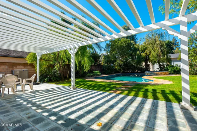 a view of a swimming pool with a patio