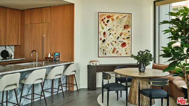 a dining room with furniture and wooden floor