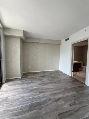 a view of balcony with wooden floor