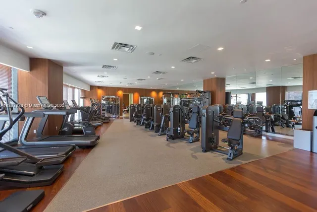a dining table with chairs and window