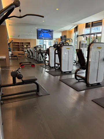 a garden with view of tall building