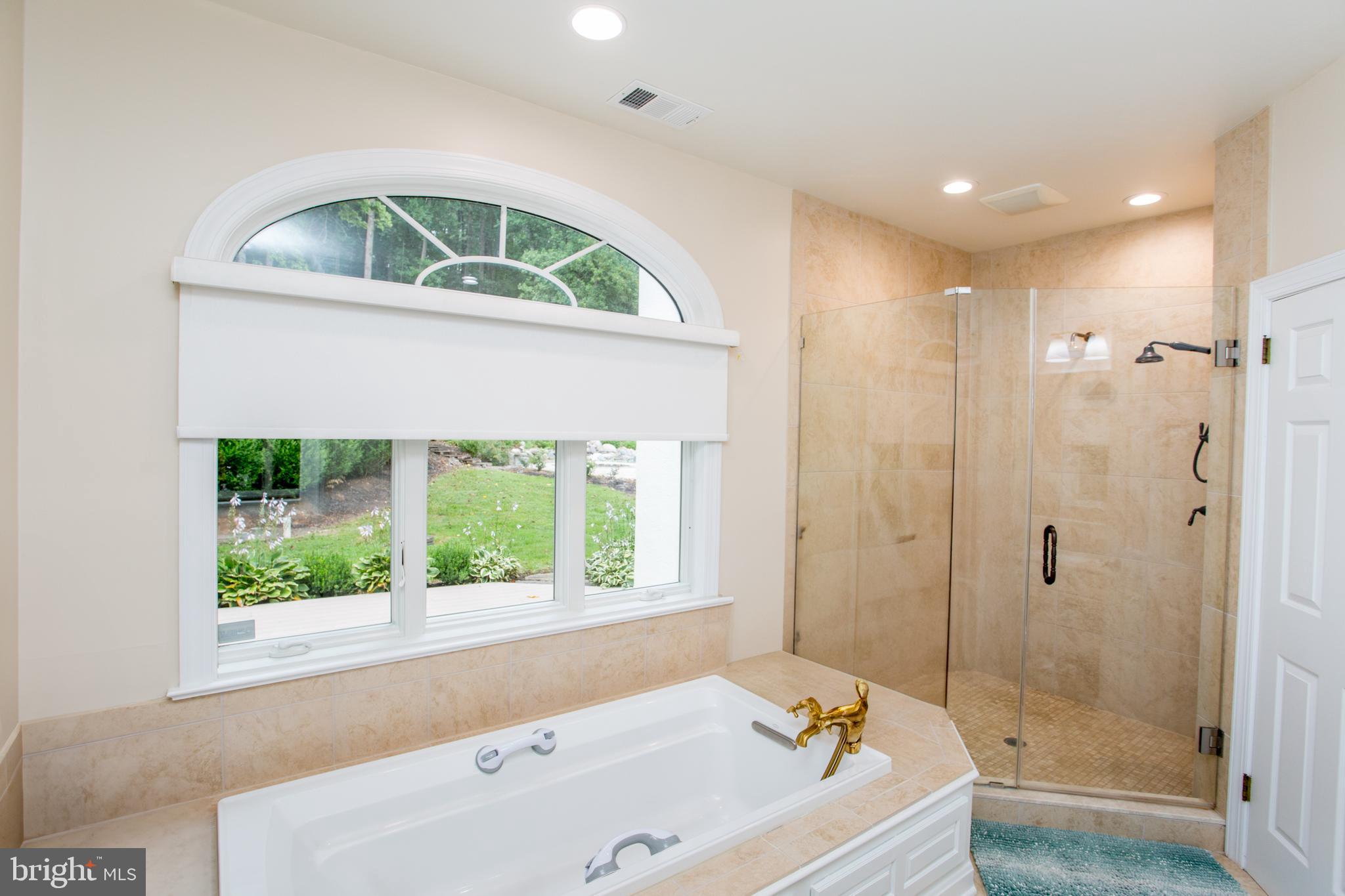 5584 Lower Mountain Road New Hope, PA 18938 - Photo 24 of 58 a bathroom with a tub and a window
