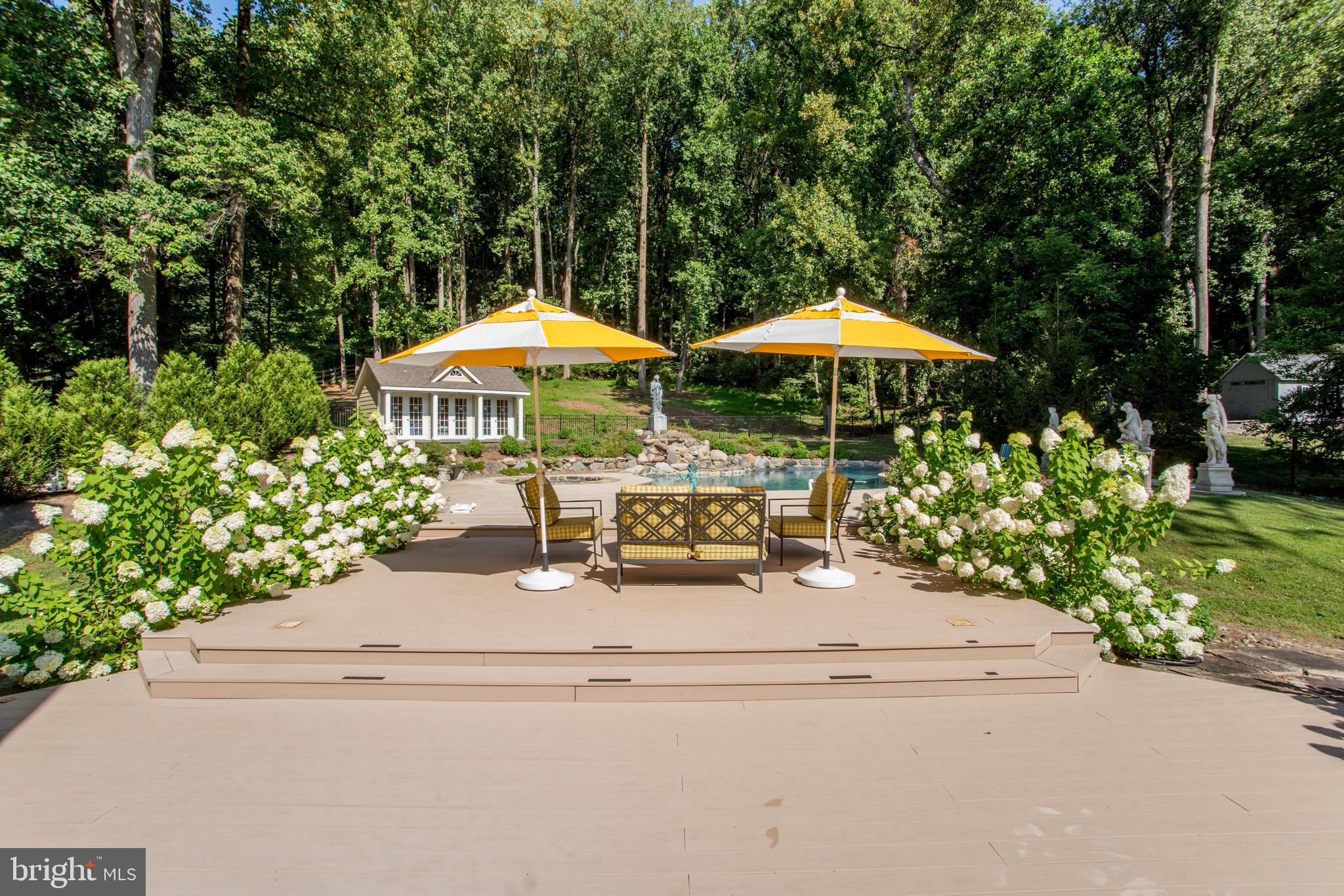 5584 Lower Mountain Road New Hope, PA 18938 - Photo 45 of 58 a view of a patio with chairs and a small yard