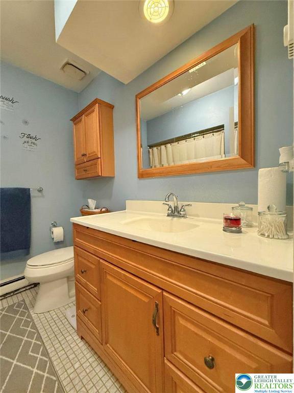 2507 Rachael Lane Orefield, PA 18069 - Photo 22 of 53 a bathroom with a sink a toilet and mirror