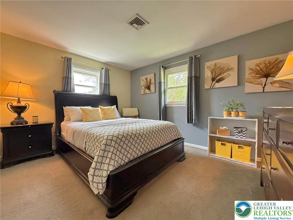 2507 Rachael Lane Orefield, PA 18069 - Photo 24 of 53 a bedroom with a bed a dresser next to a window