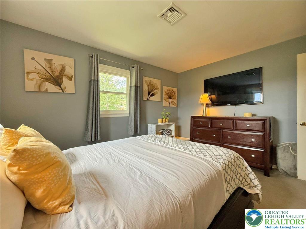 2507 Rachael Lane Orefield, PA 18069 - Photo 26 of 53 a bedroom with a bed and a flat screen tv