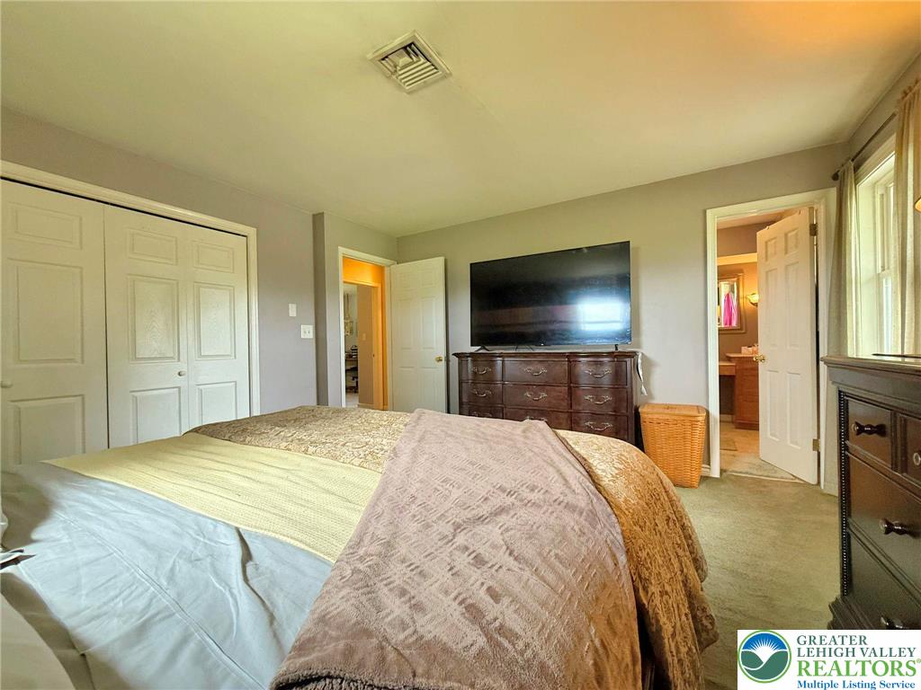 2507 Rachael Lane Orefield, PA 18069 - Photo 29 of 53 a bedroom with a bed and a flat screen tv
