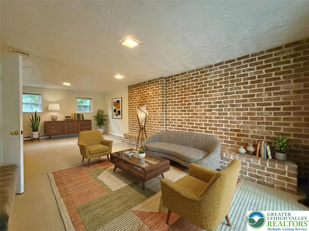 2507 Rachael Lane Orefield, PA 18069 - Photo 32 of 53 a living room with furniture and a flat screen tv