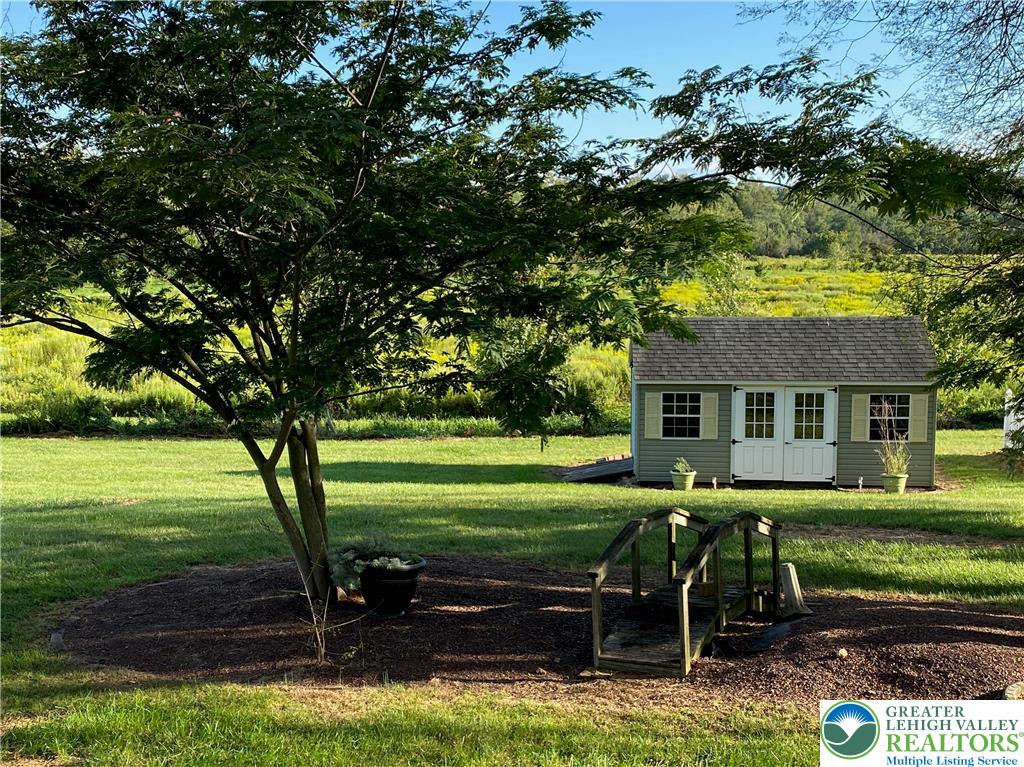 2507 Rachael Lane Orefield, PA 18069 - Photo 50 of 53 a backyard of a house with barbeque oven table and chairs