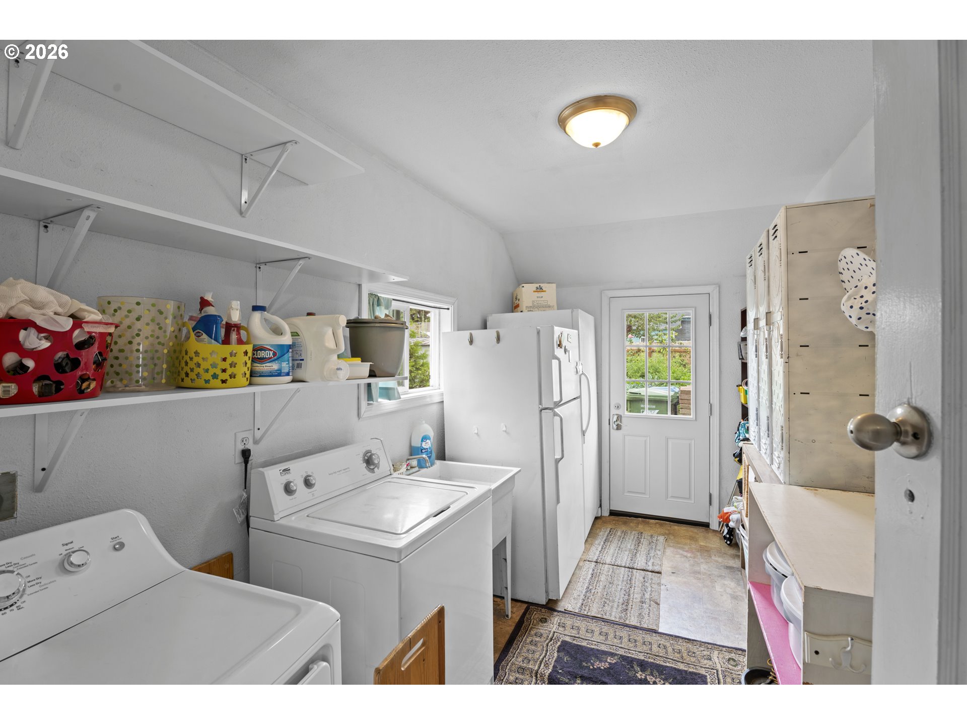 789 Hall Street Woodburn, OR 97071 - Photo 19 of 22 a utility room with dryer washer and a view of living room