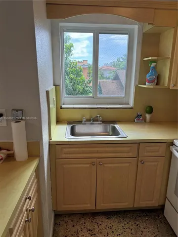 a utility room with a sink a washer and dryer