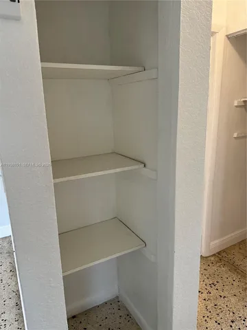 a view of small space with racks on the wall