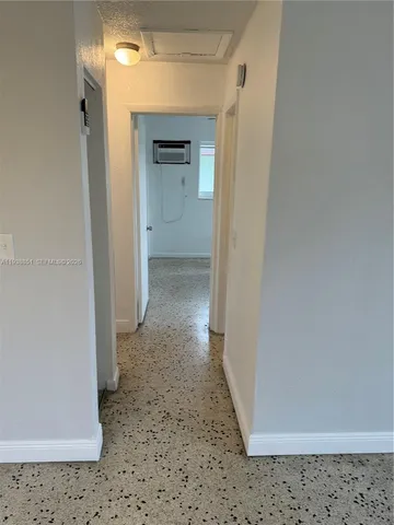 a view of a hallway with a door