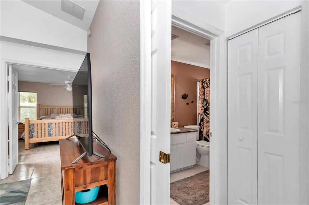 6771 Southwest 114th Street Road Ocala, FL 34476 - Photo 18 of 45 Pocket door for privacy - guest bath and bedroom