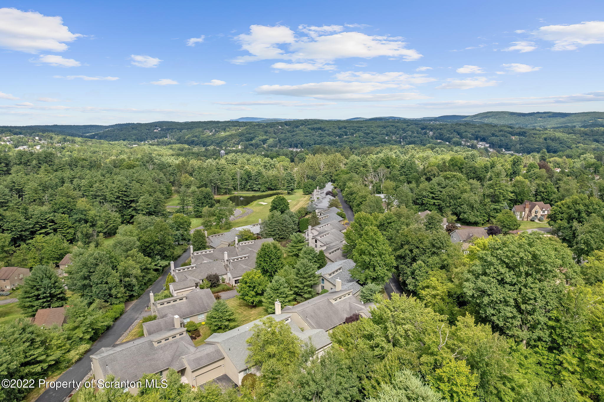 773 Greens Dallas, PA 18612 - Photo 42 of 44 an aerial view of green landscape with trees houses and mountain view