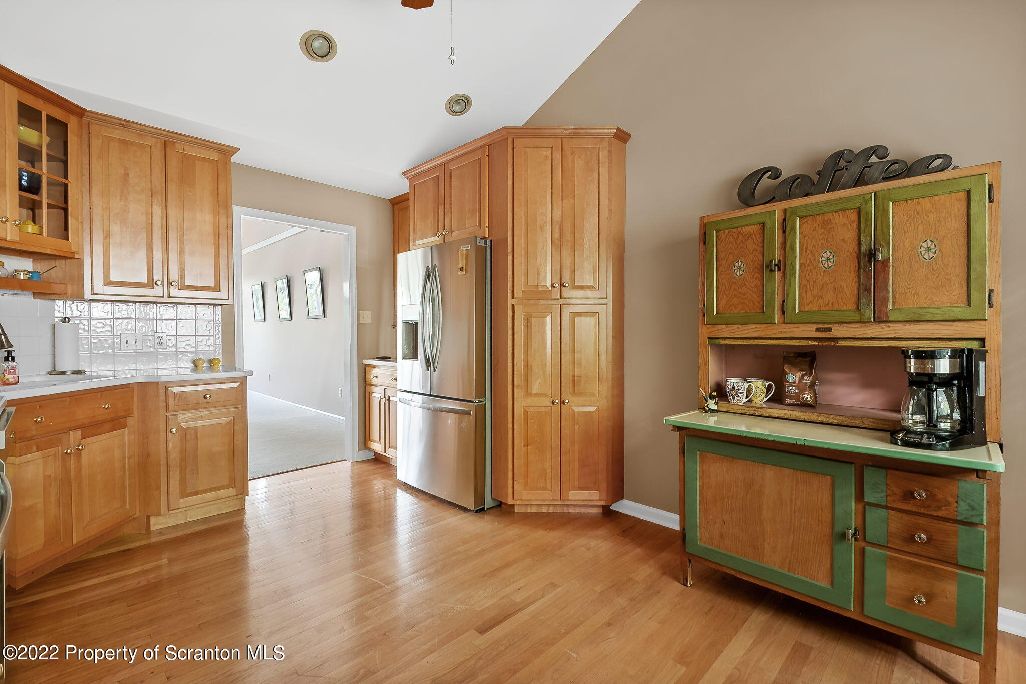 773 Greens Dallas, PA 18612 - Photo 5 of 44 a kitchen with stainless steel appliances granite countertop a refrigerator and wooden cabinets