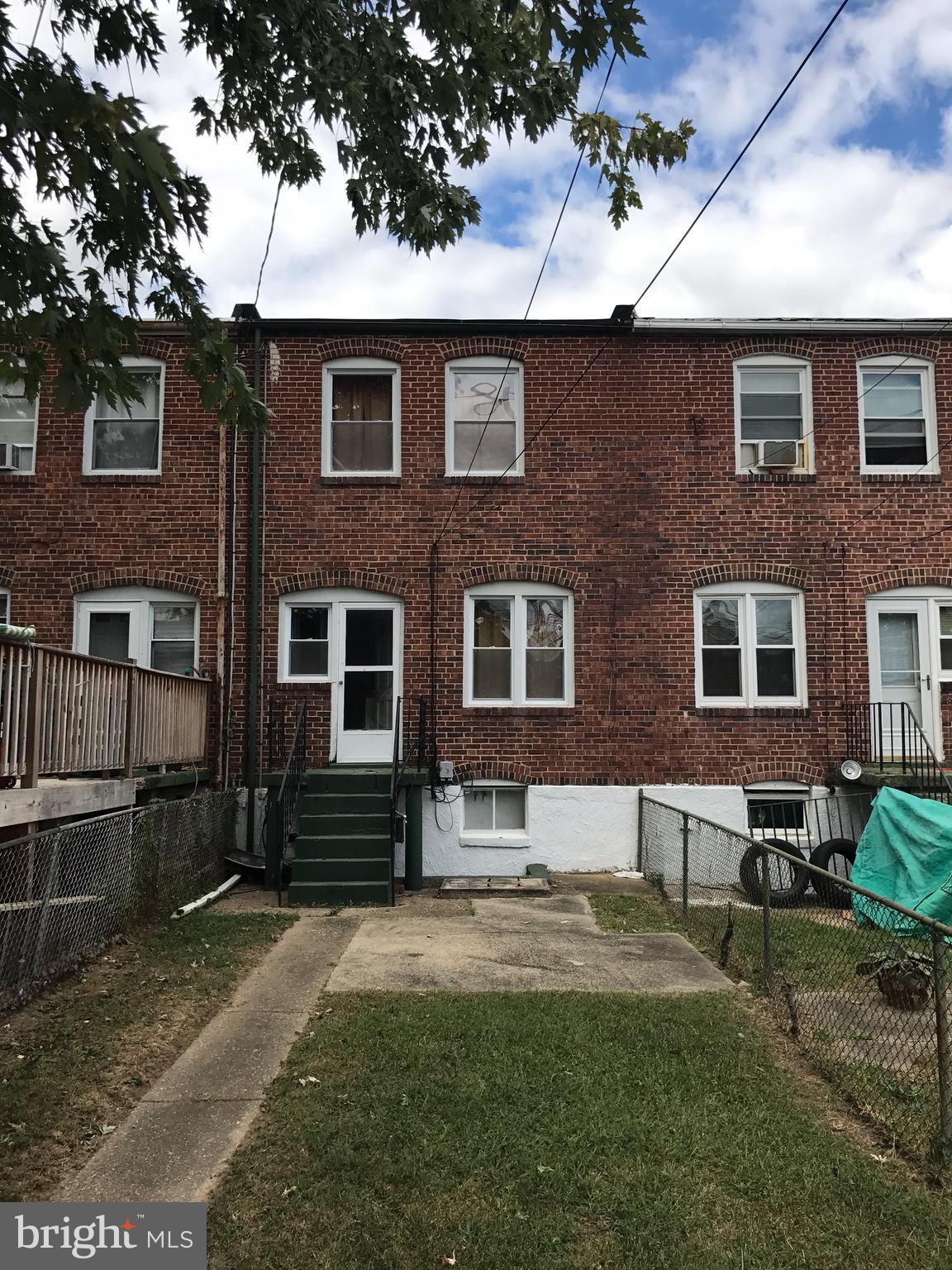 627 Cheraton Road Baltimore, MD 21225 - Photo 22 of 22 a front view of a house with garden