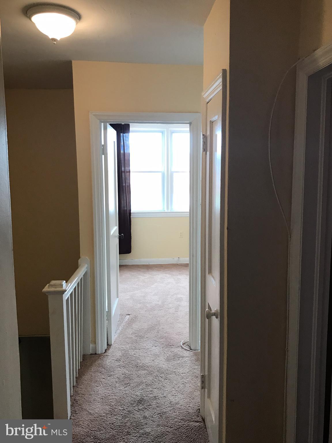 627 Cheraton Road Baltimore, MD 21225 - Photo 8 of 22 a view of an empty room with a window