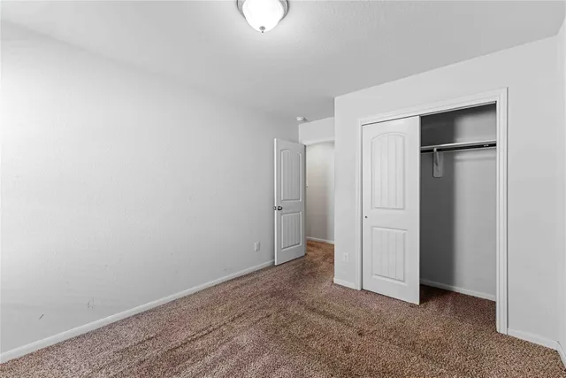 a bathroom with a double vanity sink a mirror and a bathtub