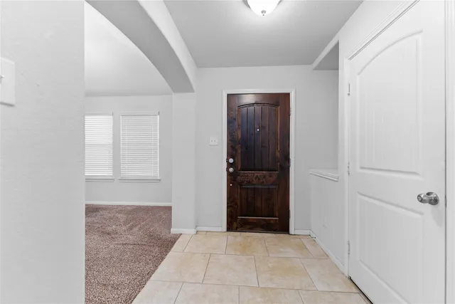 a large kitchen with cabinets and stainless steel appliances
