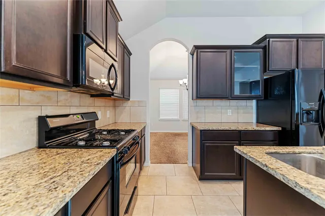 a view of a livingroom with a kitchen