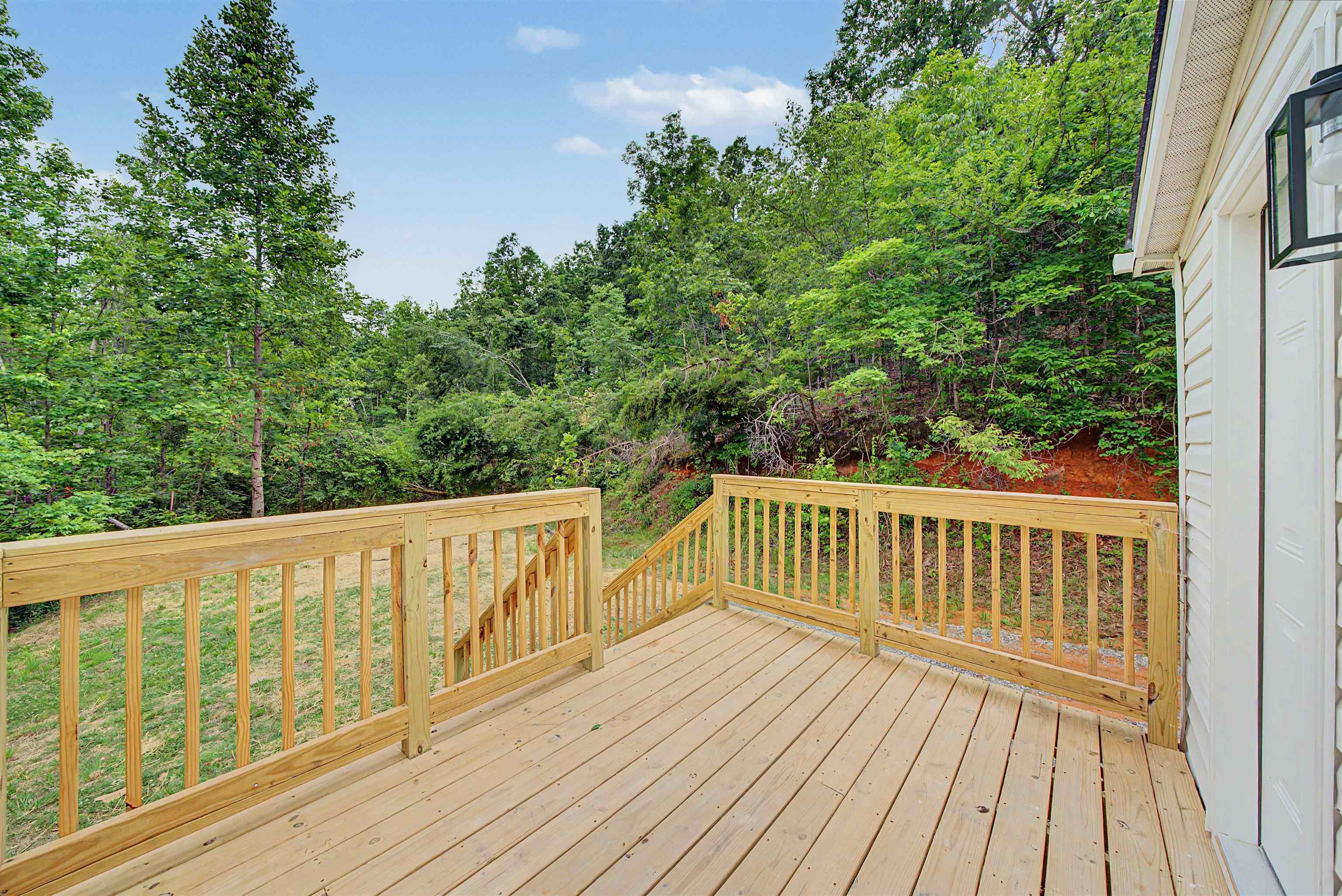890 Burks Road Savannah, TN 38372 - Photo 23 of 40 a view of balcony with wooden floor and fence