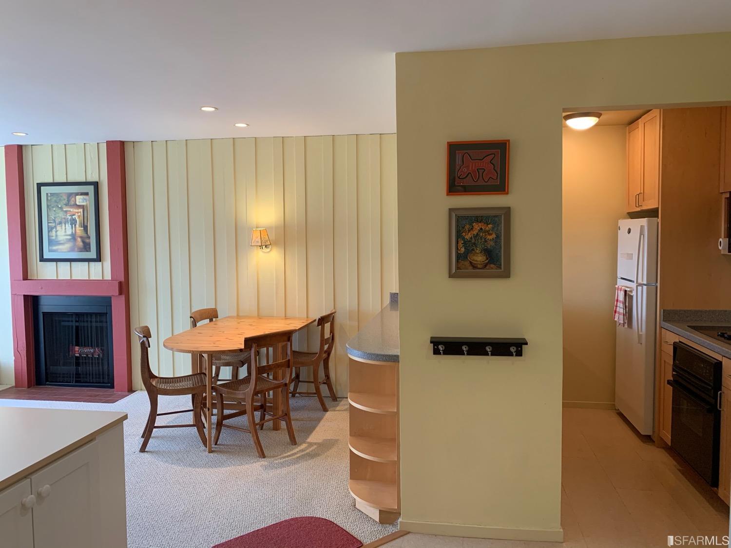 75 Ora Way, Unit D101 San Francisco, CA 94131 - Photo 21 of 29 a dining room with furniture and a fireplace