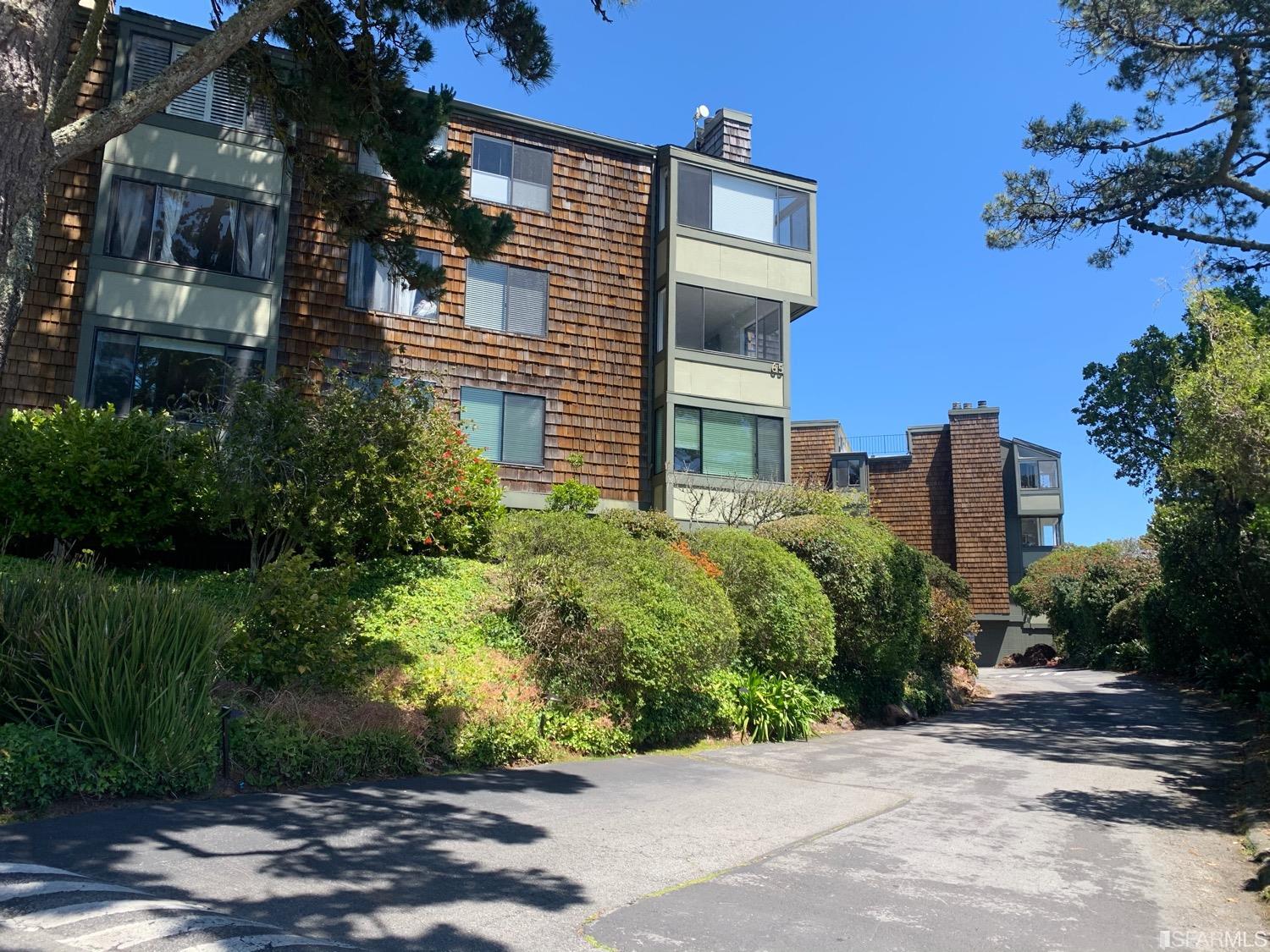 75 Ora Way, Unit D101 San Francisco, CA 94131 - Photo 26 of 29 a view of a building with a garden