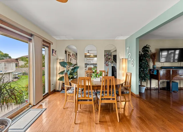a view of a dining room with furniture window and wooden floor