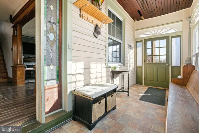 a view of an outdoor space with porch and furniture