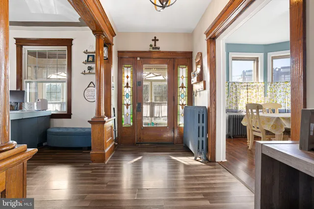 a view of a living room and hardwood floor