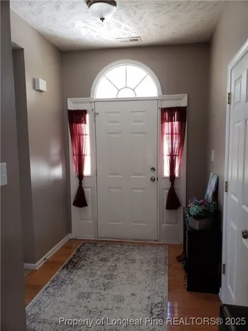 a view of livingroom with furniture and mirror