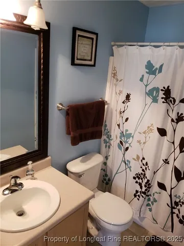 a bathroom with a sink and toilet