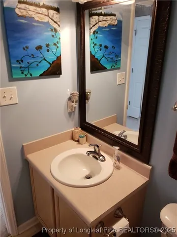 a bathroom with a sink and mirror