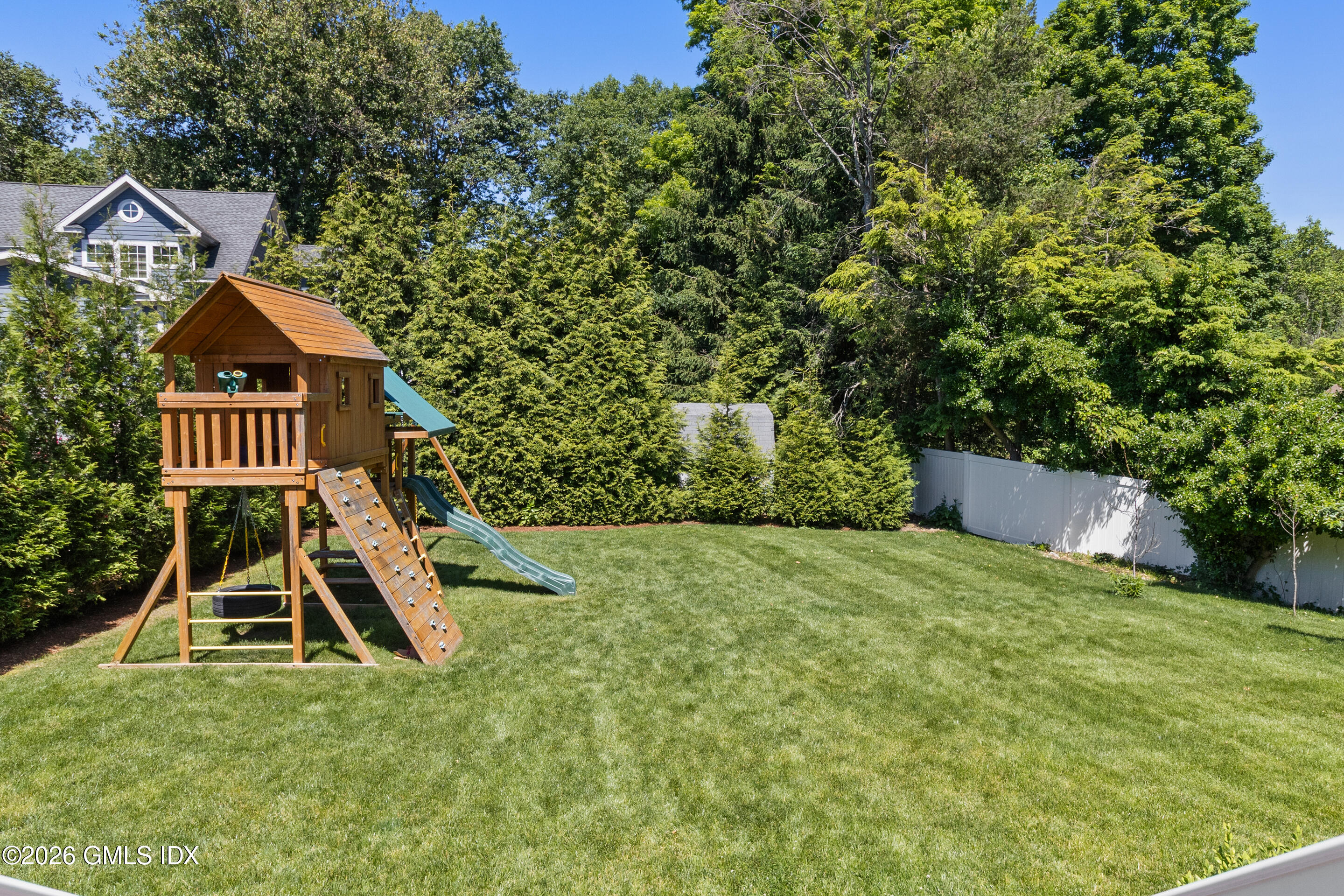 9 Deluca Drive Cos Cob, CT 06807 - Photo 27 of 30 a front view of a house with a yard